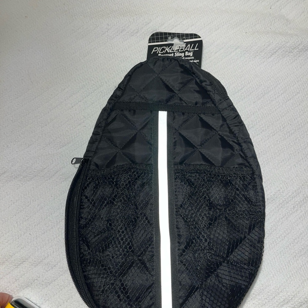 Black pickleball sling bag with reflective stripe